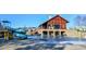 Community pool with slide and stone clubhouse, perfect for recreation and relaxation at 283 Dry Canyon Dr, Wendell, NC 27591