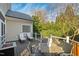 Relax on the spacious back deck with plenty of comfortable seating and a wooded view at 2920 Claremont Rd, Raleigh, NC 27608