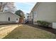 An inviting backyard with a well-maintained lawn, a deck, and a shed at 2920 Claremont Rd, Raleigh, NC 27608