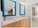Bright bathroom featuring double vanity, modern fixtures, and stylish mirrors at 2920 Claremont Rd, Raleigh, NC 27608