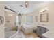 Elegant bathroom with a glass-enclosed shower, soaking tub, and travertine tile at 2920 Claremont Rd, Raleigh, NC 27608