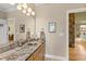 Bathroom vanity featuring a glass sink bowl and granite countertop at 2920 Claremont Rd, Raleigh, NC 27608