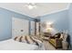 Bedroom with a luxurious faux fur throw blanket, carpet, and a view to a door leading to another room at 2920 Claremont Rd, Raleigh, NC 27608