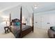 Bedroom featuring a four-poster bed, built-in closet, and vaulted ceiling at 2920 Claremont Rd, Raleigh, NC 27608