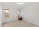 Neutral bedroom featuring two windows with bamboo blinds at 2920 Claremont Rd, Raleigh, NC 27608