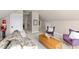 Bonus room featuring a comfortable sofa, accent chairs, and natural light at 2920 Claremont Rd, Raleigh, NC 27608
