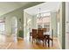 Charming dining room featuring a chandelier, natural light, and seamless access to the kitchen at 2920 Claremont Rd, Raleigh, NC 27608