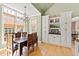 Bright dining area featuring large windows, built-in cabinetry, and an elegant chandelier at 2920 Claremont Rd, Raleigh, NC 27608