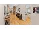 Inviting foyer featuring hardwood floors, stone accent wall, and art, creating a warm welcome at 2920 Claremont Rd, Raleigh, NC 27608