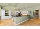Spacious kitchen boasts custom cabinets, stainless steel appliances, and granite countertops at 2920 Claremont Rd, Raleigh, NC 27608