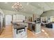 Bright kitchen with an island cooktop, stainless steel appliances, and seamless flow to the living area at 2920 Claremont Rd, Raleigh, NC 27608