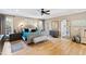 Bright main bedroom featuring a decorative bed, bedside tables, and natural light at 2920 Claremont Rd, Raleigh, NC 27608