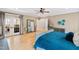Large main bedroom with French doors, hardwood floors, and stylish decor at 2920 Claremont Rd, Raleigh, NC 27608