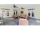 Sunroom features slate floors, ceiling fans, and a comfortable seating area at 2920 Claremont Rd, Raleigh, NC 27608