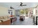 Relax in the sunroom that features slate floors, ceiling fans, and lots of natural light at 2920 Claremont Rd, Raleigh, NC 27608