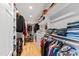 Well-organized walk-in closet with built-in shelves and hanging rods, maximizing storage at 2920 Claremont Rd, Raleigh, NC 27608