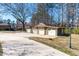 Spacious four-car garage featuring paneled doors and ample parking space on a concrete driveway at 3021 Allenby Dr, Raleigh, NC 27604
