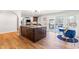 Open concept kitchen with center island, dining area, and easy access to the back patio at 3021 Allenby Dr, Raleigh, NC 27604