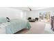 Bright main bedroom featuring neutral carpet, ceiling fan, sitting area, and sliding doors to a balcony at 3021 Allenby Dr, Raleigh, NC 27604