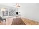 Bright office space with wood floors, neutral paint, and large windows at 3021 Allenby Dr, Raleigh, NC 27604