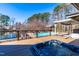 A stunning backyard oasis featuring a hot tub and an inviting pool, perfect for outdoor relaxation and entertainment at 3021 Allenby Dr, Raleigh, NC 27604