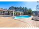 A spacious wooden deck surrounds a sparkling pool, creating an ideal setting for outdoor fun and lounging at 3021 Allenby Dr, Raleigh, NC 27604