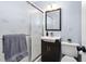 Bathroom features a modern vanity, framed mirror, and a shower with glass door at 330 Wesley Dr, Chapel Hill, NC 27516