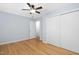 Bedroom features hardwood floors, ceiling fan, and white closet doors at 330 Wesley Dr, Chapel Hill, NC 27516