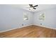 Bright bedroom with natural light, ceiling fan and hardwood flooring throughout at 330 Wesley Dr, Chapel Hill, NC 27516