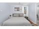 Cozy bedroom features a plush bed, soft lighting, and a view to the backyard at 330 Wesley Dr, Chapel Hill, NC 27516