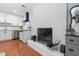 Kitchen featuring white cabinets, stainless steel appliances, and a brick fireplace at 330 Wesley Dr, Chapel Hill, NC 27516
