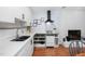 Kitchen boasts stainless appliances, bright white countertops, and a modern black range hood at 330 Wesley Dr, Chapel Hill, NC 27516