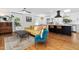 Bright living room features an open layout, hardwood floors, and a seamless transition into the modern kitchen at 330 Wesley Dr, Chapel Hill, NC 27516