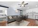 Open concept living and dining area with wood floors and blue walls at 330 Wesley Dr, Chapel Hill, NC 27516