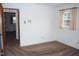 Empty bedroom featuring carpet floors, white walls, window and connecting room at 3359 Huffines Dr, Burlington, NC 27217