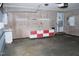 Spacious garage interior with ample room for storage and a utility sink at 3359 Huffines Dr, Burlington, NC 27217