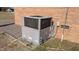 HVAC unit of brick building on small patch of grass at 3359 Huffines Dr, Burlington, NC 27217
