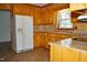 Classic kitchen features wooden cabinets, laminate countertops, and modern appliances at 3359 Huffines Dr, Burlington, NC 27217