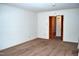 Neutral living room featuring neutral walls and carpet with door leading to hallway at 3359 Huffines Dr, Burlington, NC 27217