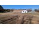 A building with a green house and storage building on a sunny day at 3359 Huffines Dr, Burlington, NC 27217