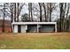 Shed with open side and front door in rural yard at 3359 Huffines Dr, Burlington, NC 27217