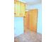 Unfinished utility room with upper cabinets and linoleum flooring at 3359 Huffines Dr, Burlington, NC 27217