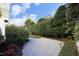 Lush backyard featuring green grass and manicured hedges creating a private outdoor space at 3937 Bentley Brook Dr, Raleigh, NC 27612
