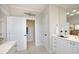 Bright bathroom featuring double vanity, mirror, tile flooring, and shower at 3937 Bentley Brook Dr, Raleigh, NC 27612