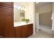 Bathroom vanity with wood cabinets and a shower/tub combo at 3937 Bentley Brook Dr, Raleigh, NC 27612