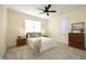Bedroom with ceiling fan, natural light, neutral color palette and carpet at 3937 Bentley Brook Dr, Raleigh, NC 27612