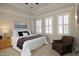 Bedroom featuring a decorative ceiling, plantation shutters, and neutral color palette at 3937 Bentley Brook Dr, Raleigh, NC 27612