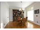 Cozy dining room features hardwood floors, built in bookshelf and ample natural light at 3937 Bentley Brook Dr, Raleigh, NC 27612