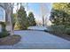 Long, paver driveway and landscaped yard offering ample parking and curb appeal at 3937 Bentley Brook Dr, Raleigh, NC 27612