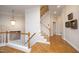A foyer with hardwood floors and staircase leading to the second level of the home at 3937 Bentley Brook Dr, Raleigh, NC 27612